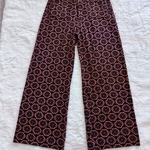 Anthropologie Maeve Floral Pants in Black and Orange